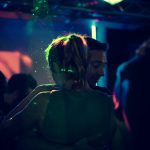 a-man-and-a-woman-dancing-at-a-party-abfxwuw5t5c